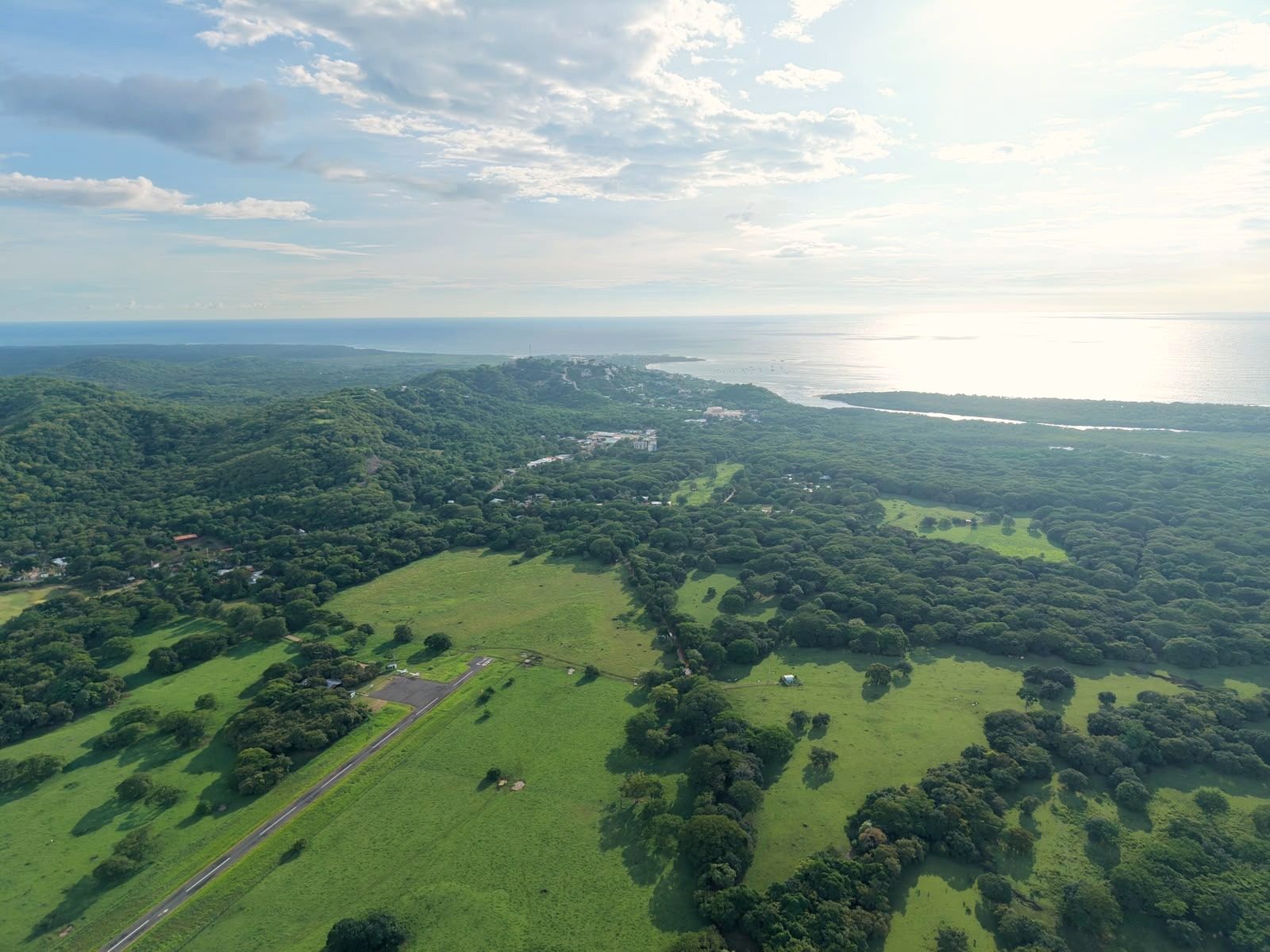 Aerial photograph of El Llano with Tamarindo and the Pacific on the horizon